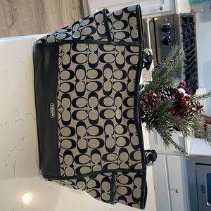 Coach black handbag. Size is 17x10